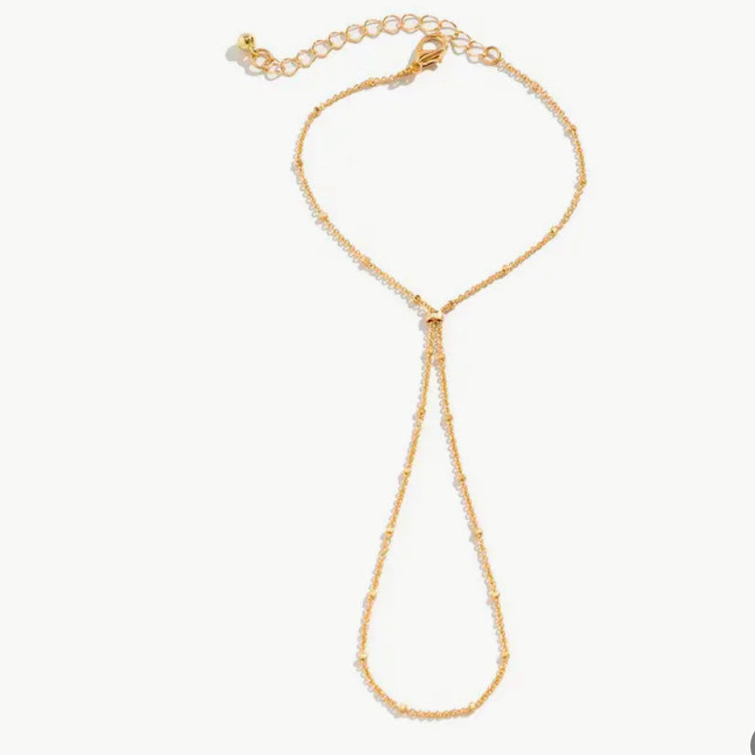 Pulseira de Mão com Bolinhas Dourado.